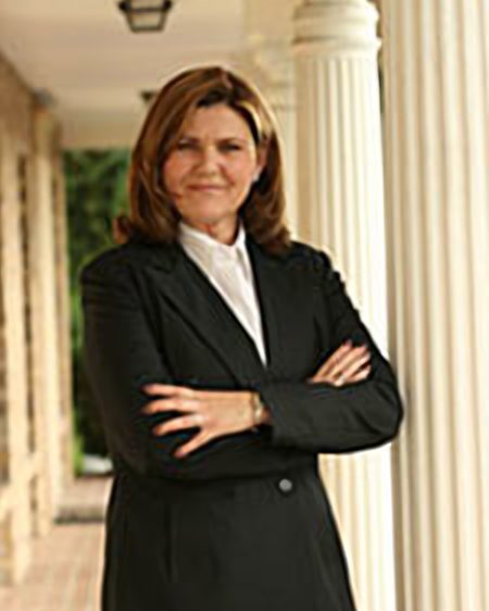 Clementine L. Conde, Florida attorney since 1992, standing outside a columned courthouse-style building